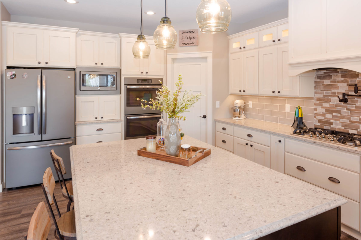 Antique Ivory Finished Kitchen with a Contrasting Island