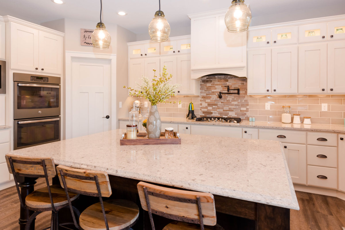 Antique Ivory Finished Kitchen with a Contrasting Island
