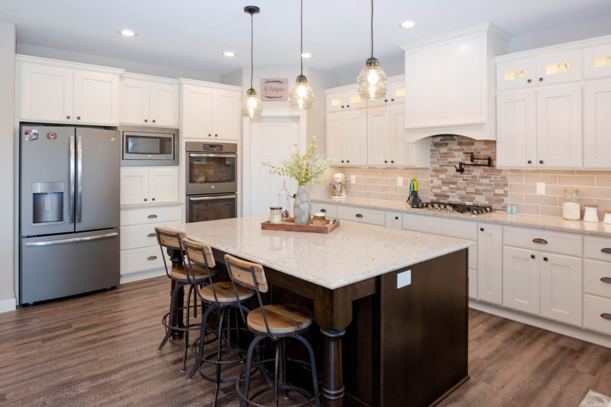 Antique Ivory Finished Kitchen with a Contrasting Island