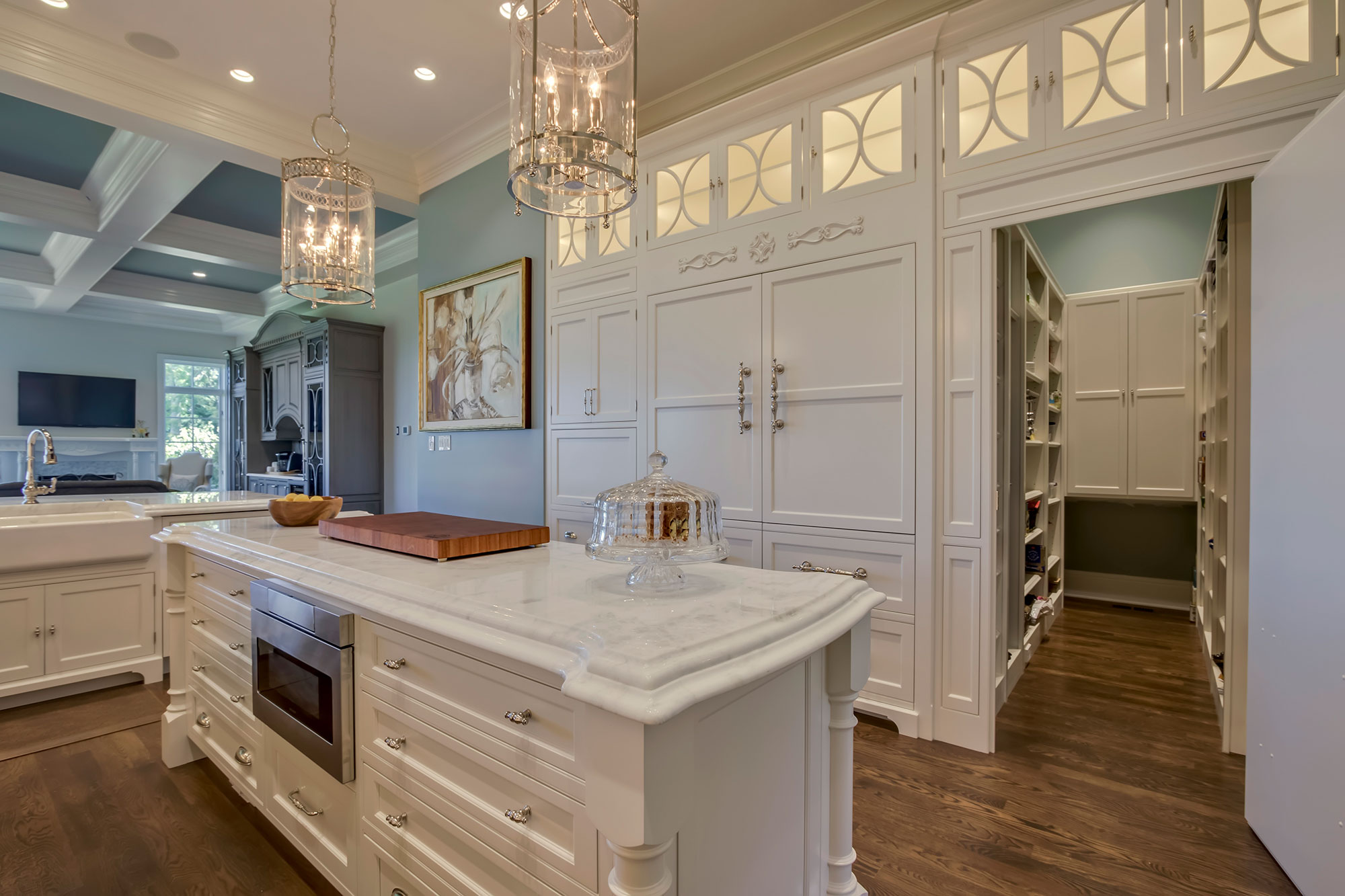 Formal White Kitchen with Custom Clock Hood