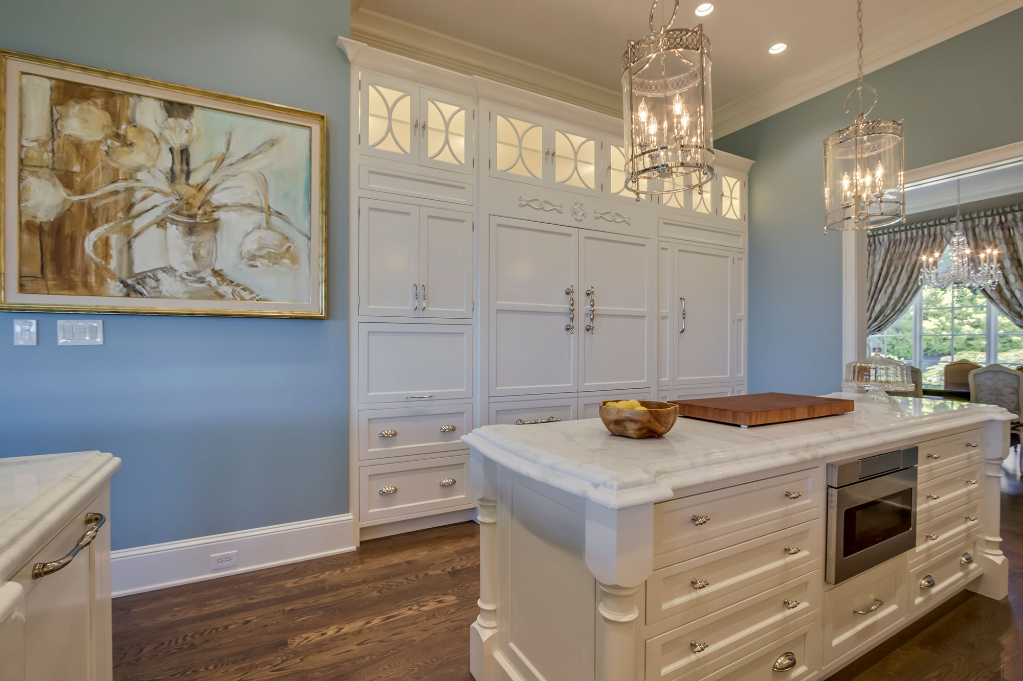 Formal White Kitchen with Custom Clock Hood