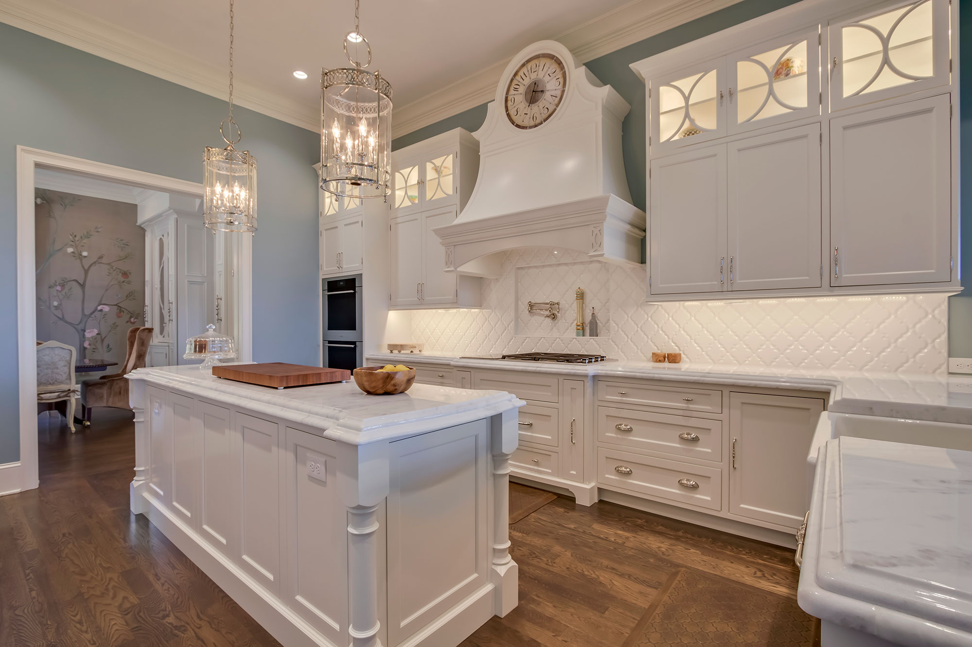 Formal White Kitchen with Custom Clock Hood