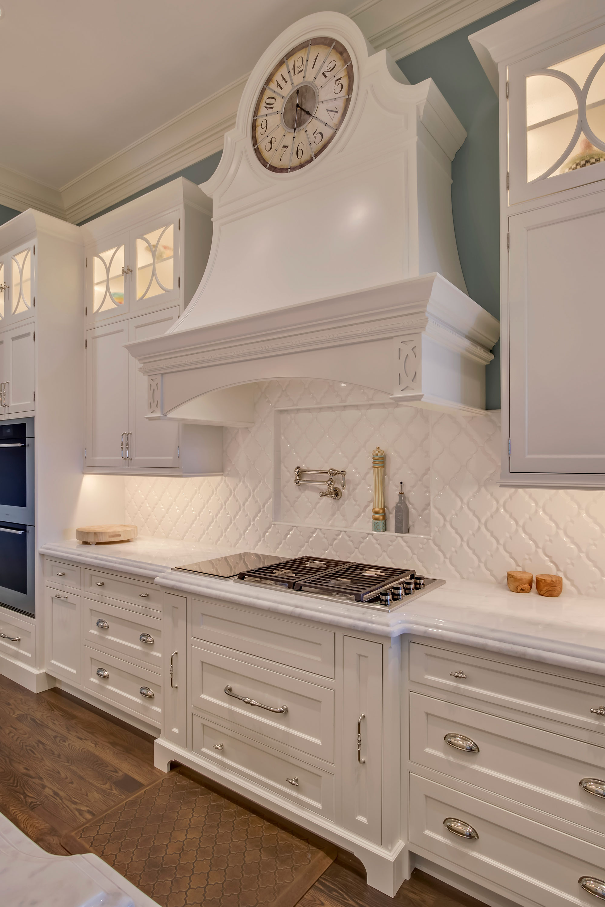 Formal White Kitchen with Custom Clock Hood