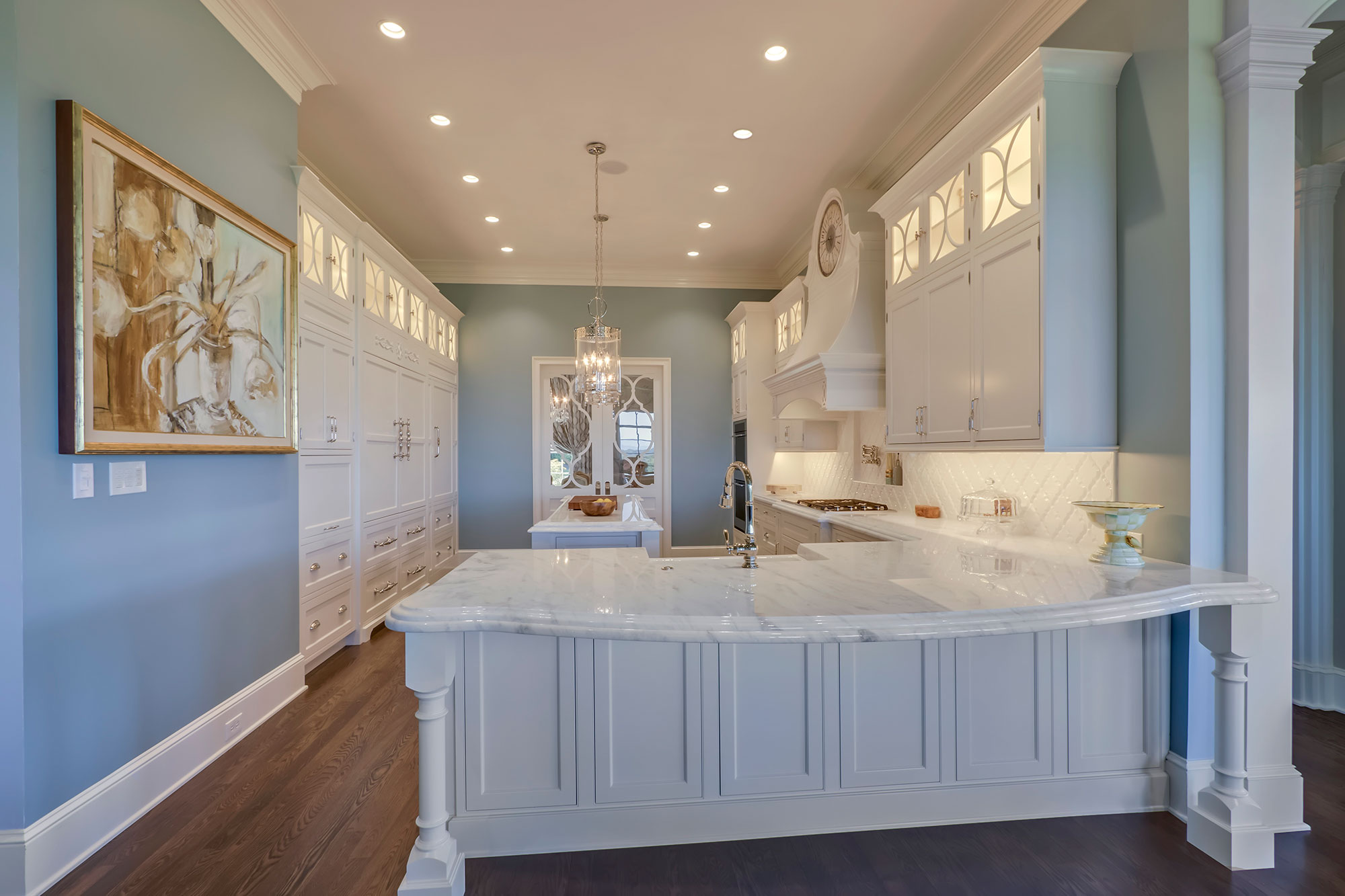 Formal White Kitchen with Custom Clock Hood
