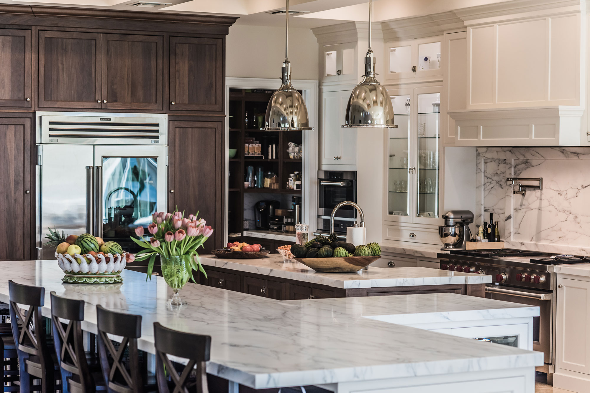 Large White Kitchen with Two Islands