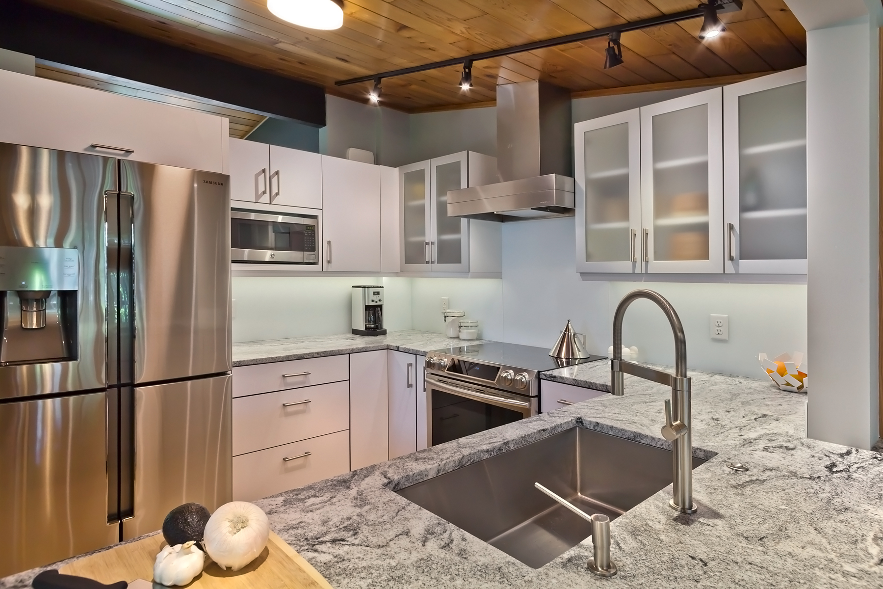 Matte White Kitchen with Arizona Cypress Storage Cabinets